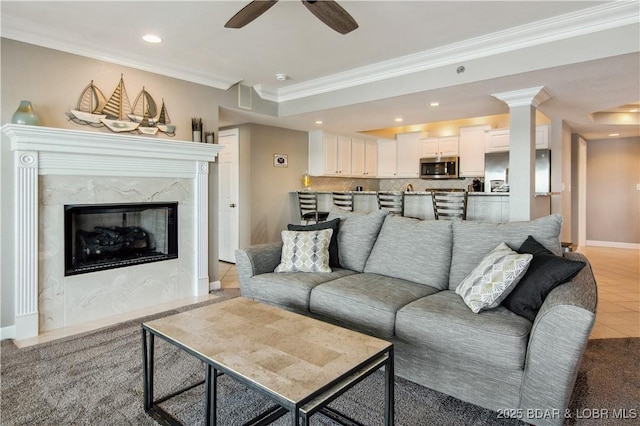 68 Lighthouse Rd Unit 906, Lake Ozark, MO 65049 - living room featuring ornamental molding, recessed lighting, a ceiling fan, and a fireplace