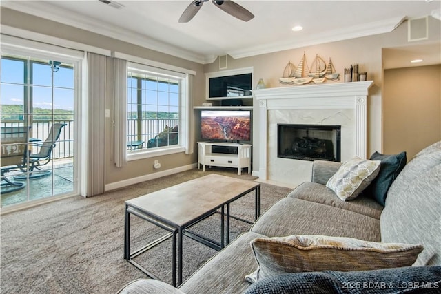 68 Lighthouse Rd Unit 906, Lake Ozark, MO 65049 - living room featuring ornamental molding, carpet flooring, ceiling fan, and a premium fireplace