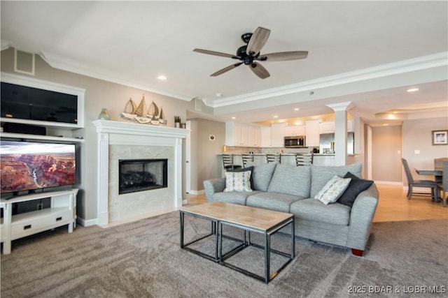 68 Lighthouse Rd Unit 906, Lake Ozark, MO 65049 - carpeted living room with crown molding, recessed lighting, ceiling fan, and a fireplace