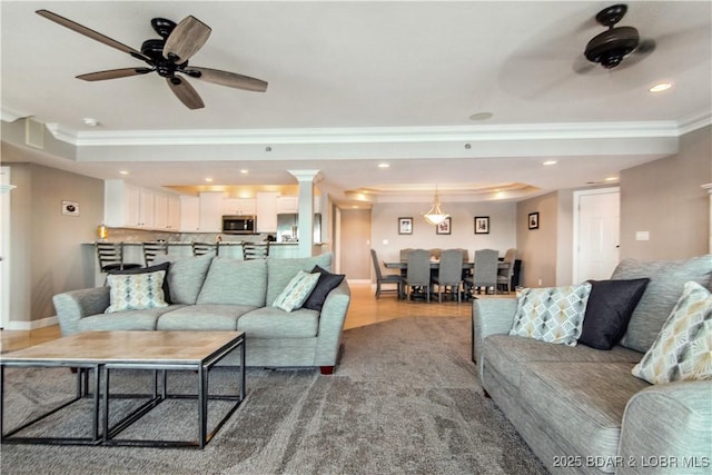 68 Lighthouse Rd Unit 906, Lake Ozark, MO 65049 - living area featuring crown molding, a ceiling fan, a raised ceiling, and recessed lighting