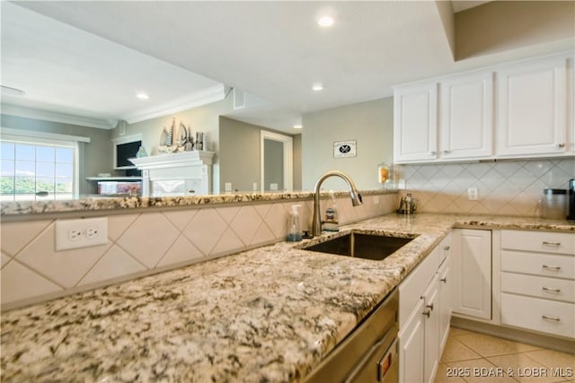 68 Lighthouse Rd Unit 906, Lake Ozark, MO 65049 - kitchen with light stone countertops, light tile patterned floors, white cabinets, tasteful backsplash, and ornamental molding