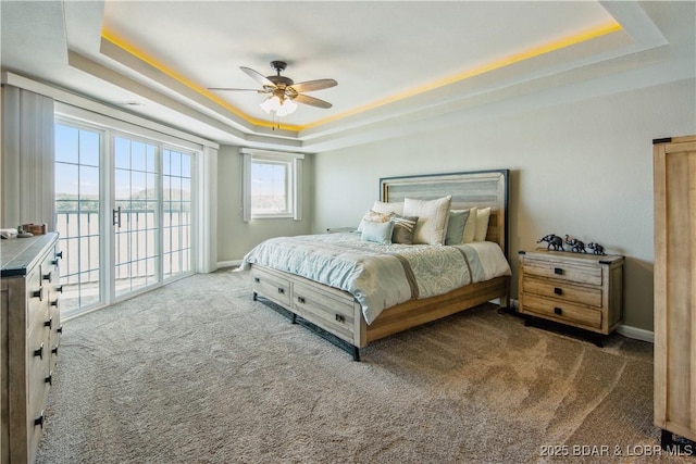 68 Lighthouse Rd Unit 906, Lake Ozark, MO 65049 - bedroom with a tray ceiling, carpet flooring, access to outside, a ceiling fan, and a water view
