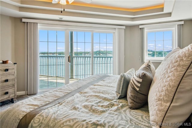 68 Lighthouse Rd Unit 906, Lake Ozark, MO 65049 - carpeted bedroom with access to outside, a raised ceiling, and a water view