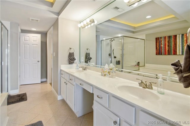68 Lighthouse Rd Unit 906, Lake Ozark, MO 65049 - bathroom with tile patterned flooring, a shower stall, double vanity, and a tray ceiling