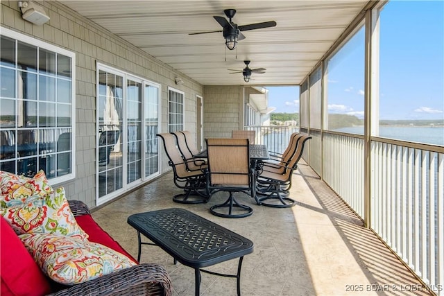 68 Lighthouse Rd Unit 906, Lake Ozark, MO 65049 - sunroom with a ceiling fan, a water view, and outdoor dining area