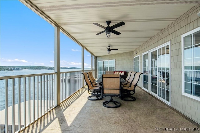 68 Lighthouse Rd Unit 906, Lake Ozark, MO 65049 - sunroom with a water view, a ceiling fan, and outdoor dining space