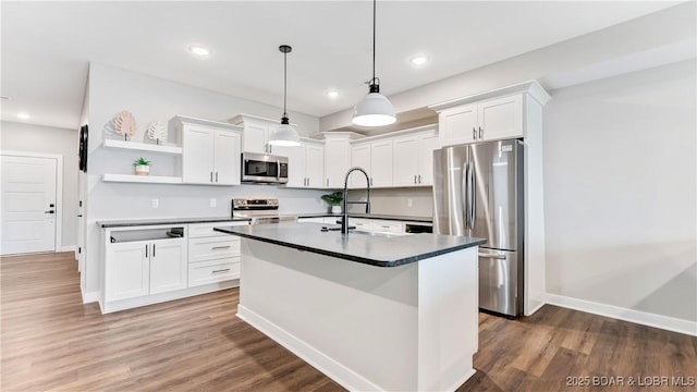 104 Sierra Bay Dr Unit 1B, Camdenton, MO 65020 - kitchen with stainless steel appliances, dark countertops, open shelves, white cabinetry, and recessed lighting