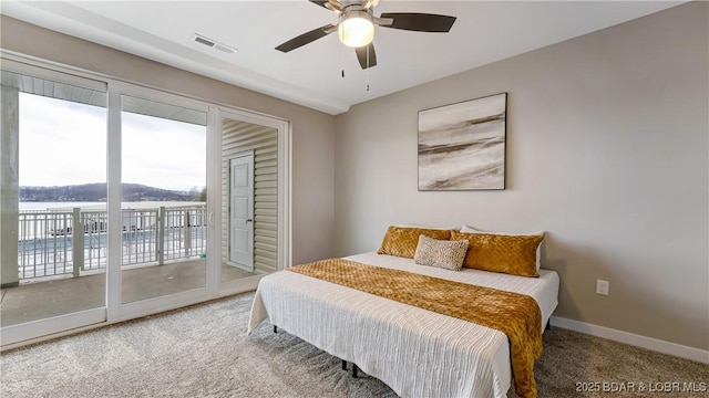 104 Sierra Bay Dr Unit 1B, Camdenton, MO 65020 - bedroom with access to exterior, carpet, multiple windows, and a ceiling fan