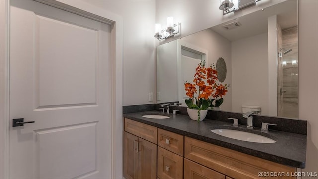 104 Sierra Bay Dr Unit 1B, Camdenton, MO 65020 - bathroom featuring double vanity and a shower with shower door