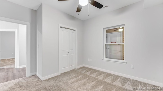 104 Sierra Bay Dr Unit 1B, Camdenton, MO 65020 - unfurnished bedroom featuring carpet floors, a closet, and a ceiling fan