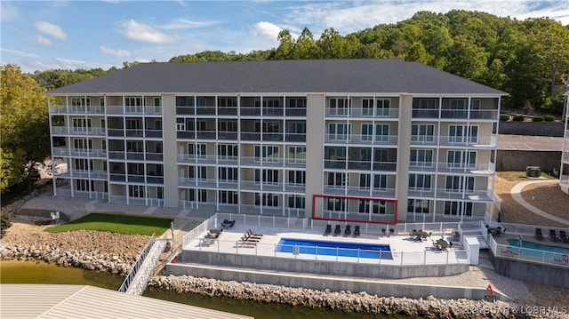 104 Sierra Bay Dr Unit 1B, Camdenton, MO 65020 - view of apartment building / complex featuring a community pool and a water view