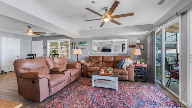 1201 W Harbour Towne Dr Unit 1201, Lake Ozark, MO 65049 - living area featuring ceiling fan, plenty of natural light, and wood finished floors