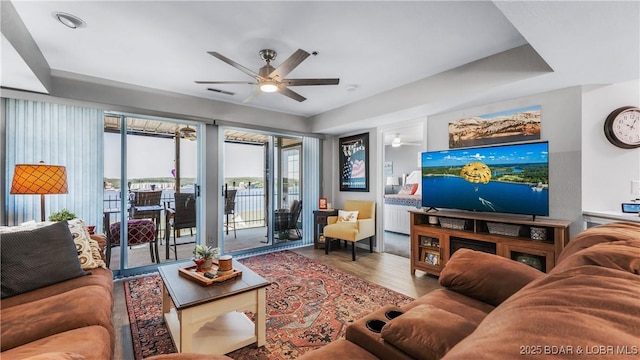 1201 W Harbour Towne Dr Unit 1201, Lake Ozark, MO 65049 - living room featuring a ceiling fan and wood finished floors