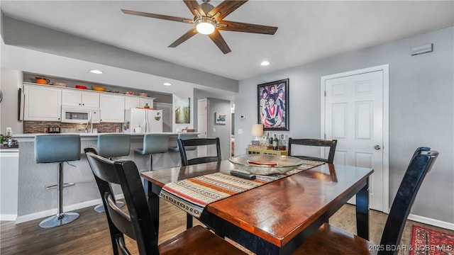 1201 W Harbour Towne Dr Unit 1201, Lake Ozark, MO 65049 - dining room featuring wood finished floors, ceiling fan, and recessed lighting