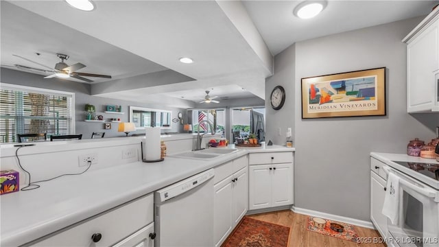 1201 W Harbour Towne Dr Unit 1201, Lake Ozark, MO 65049 - kitchen featuring white appliances, ceiling fan, light wood-style floors, light countertops, and white cabinets