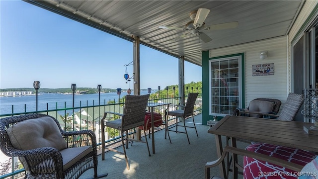 1201 W Harbour Towne Dr Unit 1201, Lake Ozark, MO 65049 - view of patio / terrace with a water view and a ceiling fan