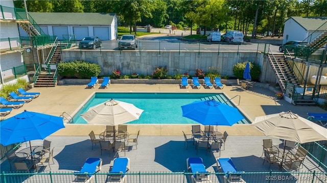 1201 W Harbour Towne Dr Unit 1201, Lake Ozark, MO 65049 - community pool with stairs and view of wooded area