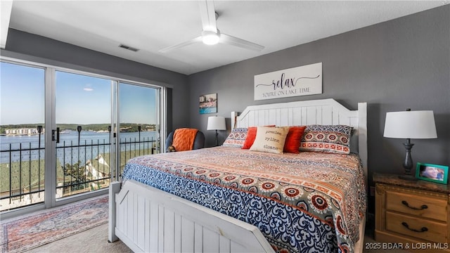 1201 W Harbour Towne Dr Unit 1201, Lake Ozark, MO 65049 - carpeted bedroom featuring access to outside, a water view, and ceiling fan