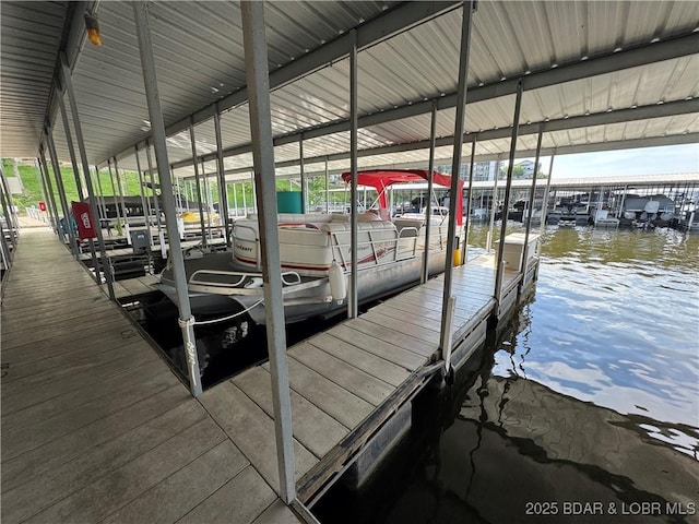 1201 W Harbour Towne Dr Unit 1201, Lake Ozark, MO 65049 - dock area featuring boat lift and a water view