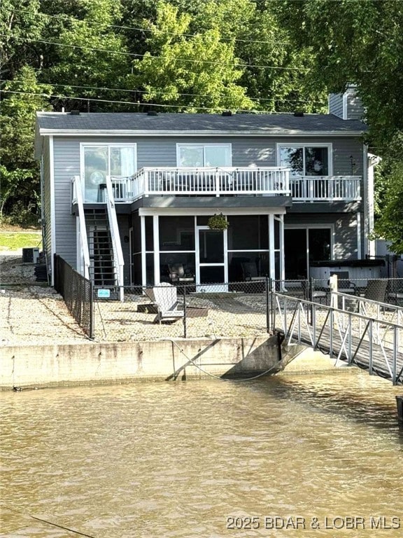 63 Rock Dove Ln, Camdenton, MO 65020 - back of property with stairway and a chimney