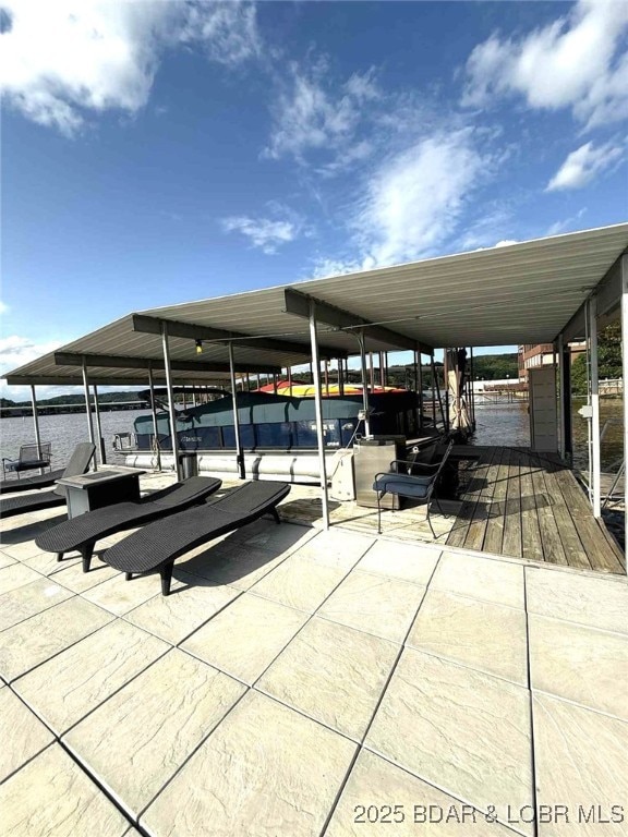 63 Rock Dove Ln, Camdenton, MO 65020 - view of patio / terrace featuring a dock, boat lift, and a water view