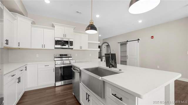 104 Sierra Bay Dr Unit 1C, Camdenton, MO 65020 - kitchen with stainless steel appliances, a barn door, open shelves, recessed lighting, and dark wood-style flooring