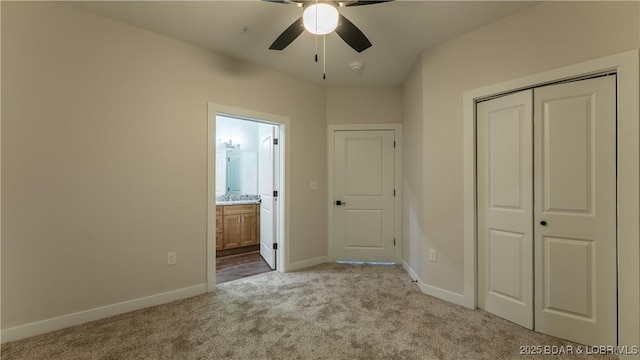 104 Sierra Bay Dr Unit 1C, Camdenton, MO 65020 - unfurnished bedroom featuring carpet flooring, a closet, ensuite bathroom, and ceiling fan