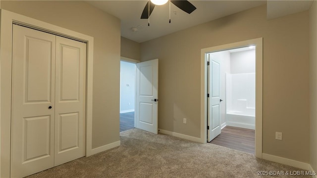 104 Sierra Bay Dr Unit 1C, Camdenton, MO 65020 - unfurnished bedroom with carpet floors, a closet, ensuite bathroom, and ceiling fan