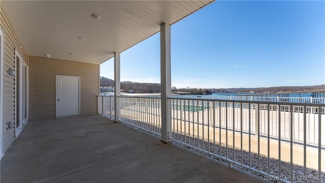 104 Sierra Bay Dr Unit 1C, Camdenton, MO 65020 - view of patio with a water view