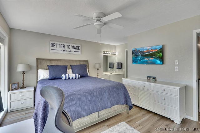 2500 Bay Point Dr Unit 331, Osage Beach, MO 65065 - bedroom featuring light wood-style flooring, ensuite bath, and ceiling fan