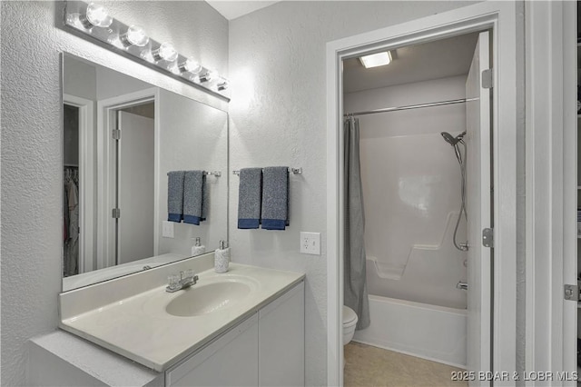 2500 Bay Point Dr Unit 331, Osage Beach, MO 65065 - bathroom featuring a textured wall, vanity, shower / bath combo with shower curtain, and tile patterned flooring
