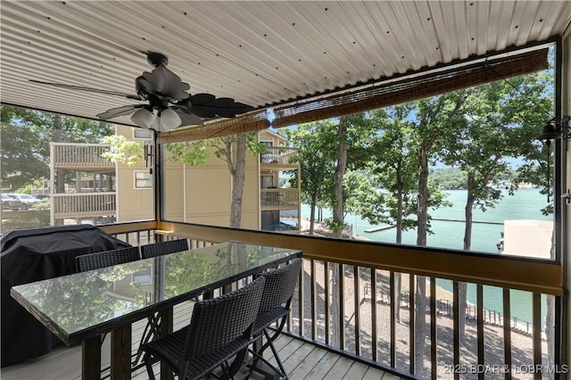 2500 Bay Point Dr Unit 331, Osage Beach, MO 65065 - wooden deck with a water view, outdoor dining space, and a ceiling fan