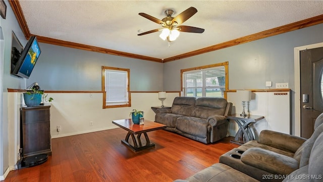 121 W 9th St, Eldon, MO 65026 - living room with ceiling fan, crown molding, wood finished floors, and a textured ceiling