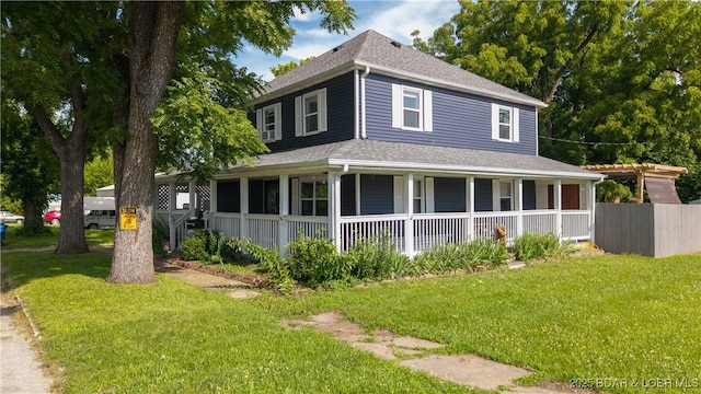 121 W 9th St, Eldon, MO 65026 - view of side of home with a porch, a shingled roof, and a yard