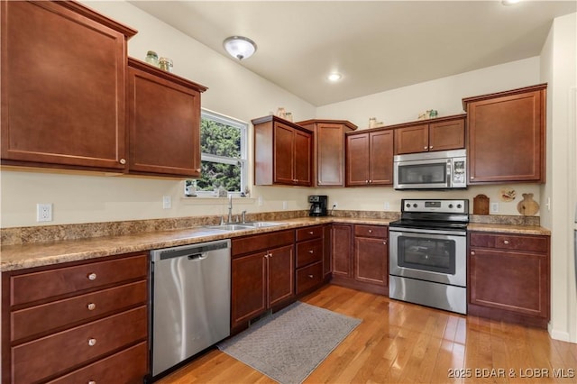 396 Elm Tree Ln, Camdenton, MO 65020 - kitchen with stainless steel appliances, light wood-style floors, light countertops, and recessed lighting