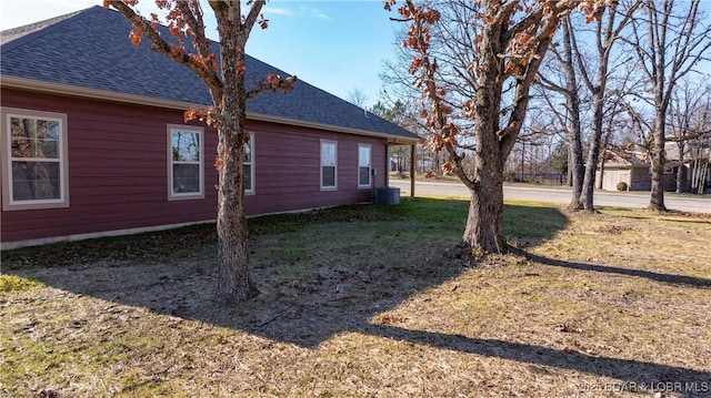 60 Lady Bug Ln, Camdenton, MO 65020 - view of property exterior with a shingled roof and a lawn