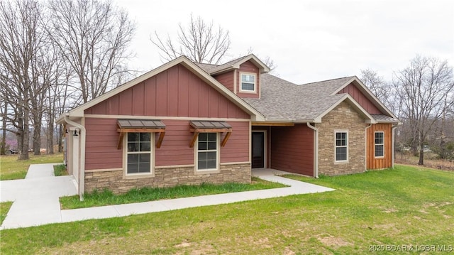 60 Lady Bug Ln, Camdenton, MO 65020 - craftsman house with stone siding, a front yard, board and batten siding, and roof with shingles