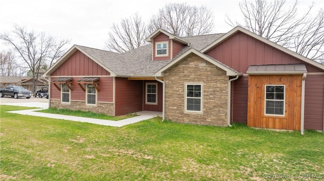 60 Lady Bug Ln, Camdenton, MO 65020 - view of front of house with stone siding, roof with shingles, and a front yard