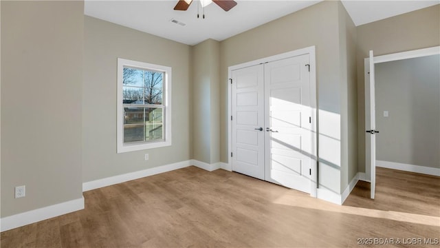 60 Lady Bug Ln, Camdenton, MO 65020 - unfurnished bedroom with wood finished floors and a ceiling fan