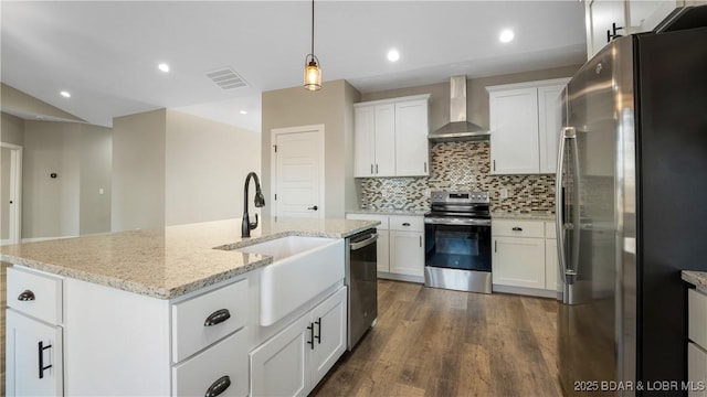 60 Lady Bug Ln, Camdenton, MO 65020 - kitchen featuring appliances with stainless steel finishes, wall chimney exhaust hood, dark wood-style floors, white cabinets, and backsplash
