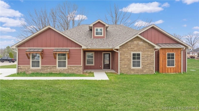 60 Lady Bug Ln, Camdenton, MO 65020 - craftsman house featuring stone siding, board and batten siding, a shingled roof, and a front lawn