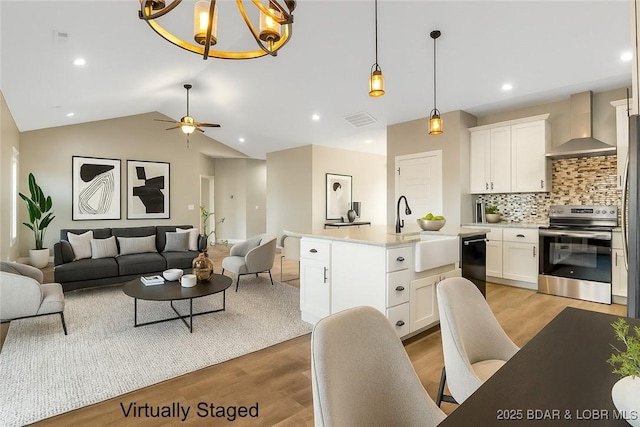 60 Lady Bug Ln, Camdenton, MO 65020 - kitchen with stainless steel electric range oven, wall chimney exhaust hood, dishwasher, open floor plan, and light wood-type flooring