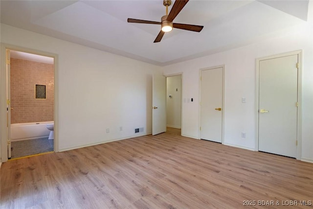 1408 Dogwood Ln, Osage Beach, MO 65065 - unfurnished bedroom featuring light wood-style floors and ensuite bathroom