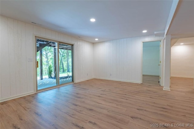 1408 Dogwood Ln, Osage Beach, MO 65065 - empty room featuring wood finished floors, wood walls, and recessed lighting