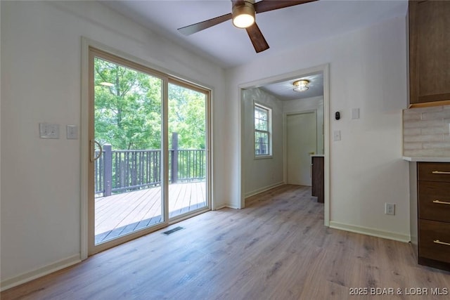 1408 Dogwood Ln, Osage Beach, MO 65065 - unfurnished dining area featuring light wood-type flooring and ceiling fan