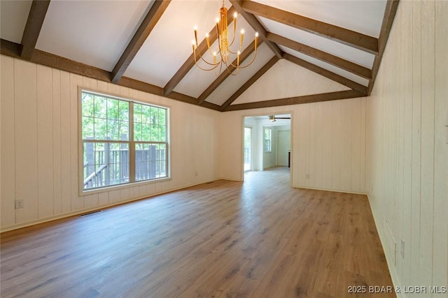 1408 Dogwood Ln, Osage Beach, MO 65065 - unfurnished living room with a chandelier, wood finished floors, and wooden walls
