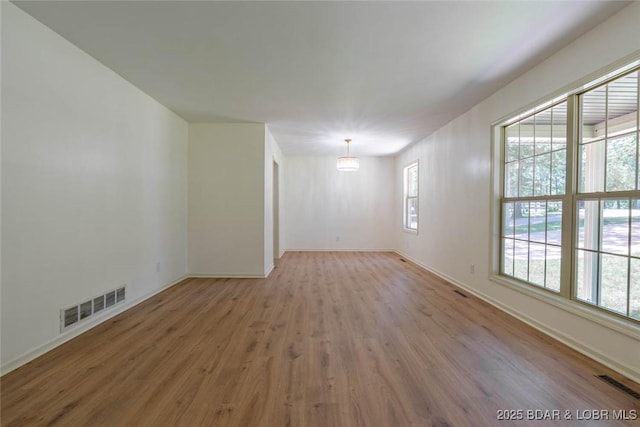1408 Dogwood Ln, Osage Beach, MO 65065 - spare room featuring wood finished floors and baseboards