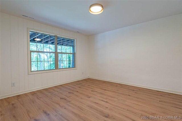 1408 Dogwood Ln, Osage Beach, MO 65065 - spare room featuring wood finished floors and baseboards