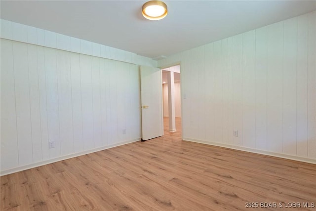 1408 Dogwood Ln, Osage Beach, MO 65065 - spare room featuring wood finished floors and wooden walls