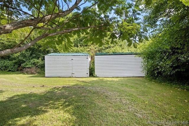 901 Larkin Dr, Eldon, MO 65026 - view of green lawn featuring a storage unit